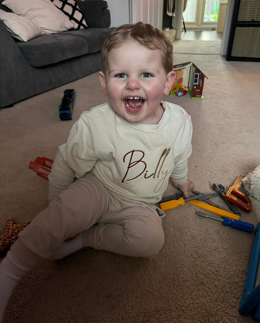 Nude Jumper with Brown Signature Font