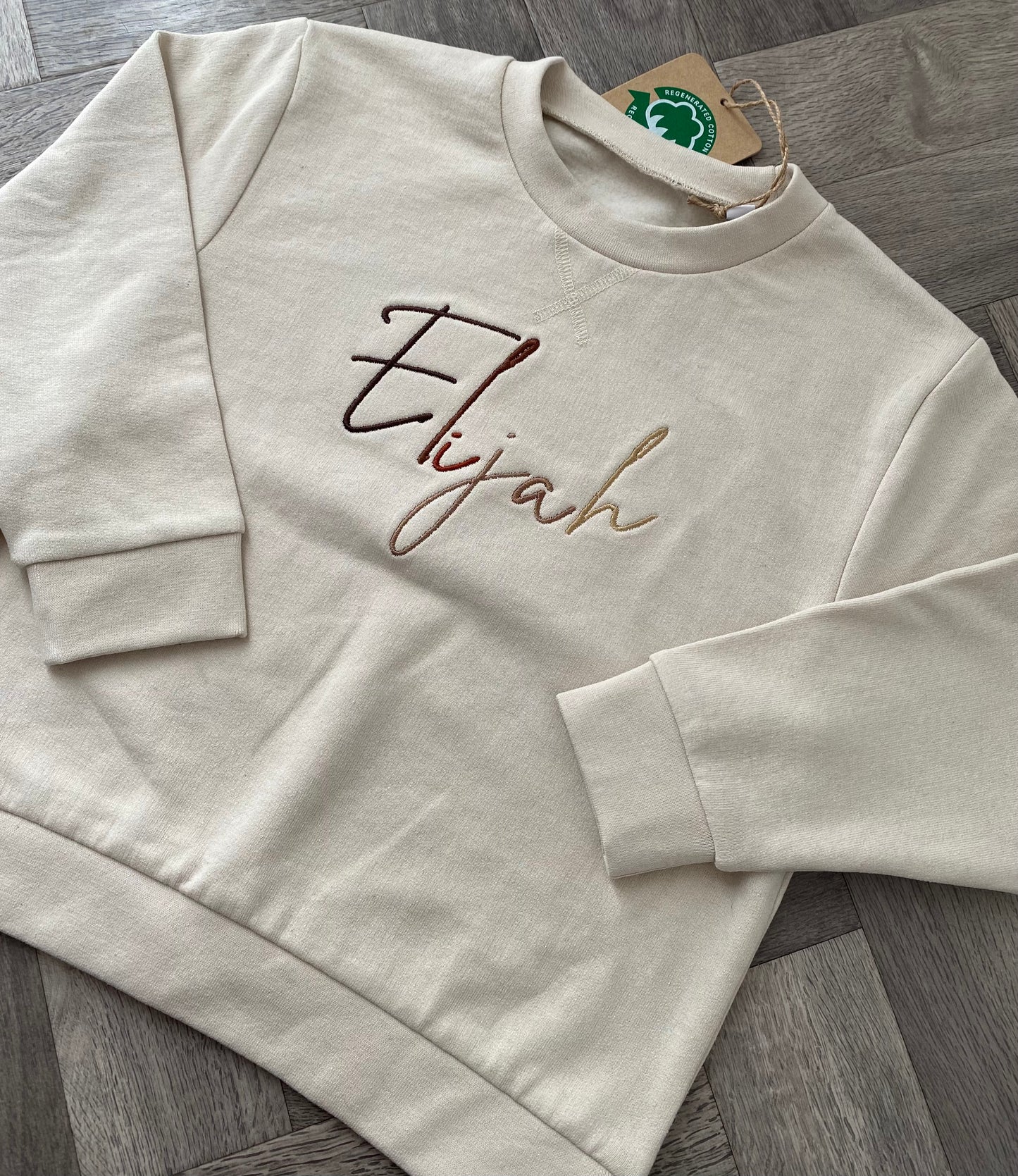 Nude Jumper with Brown Signature Font