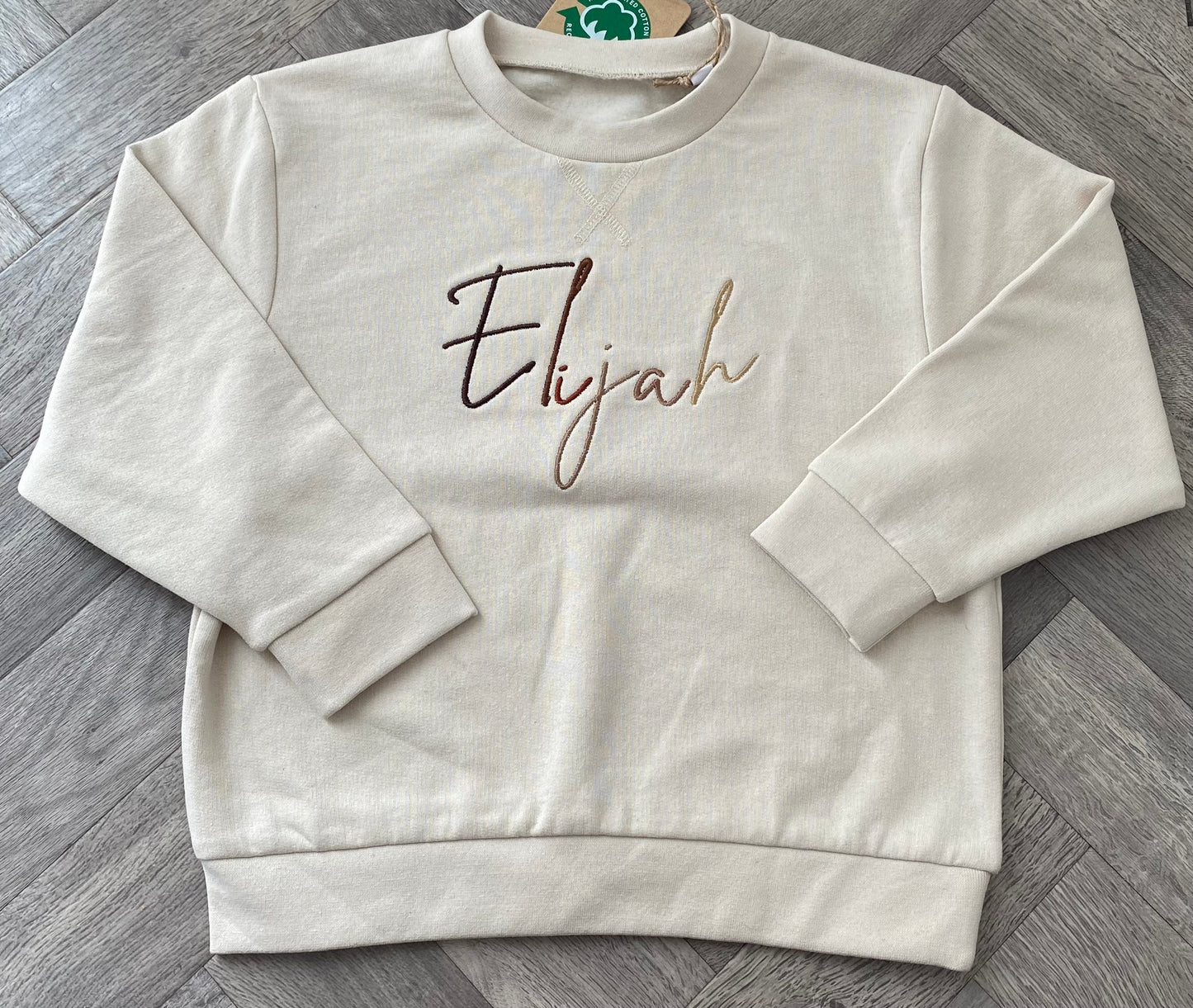 Nude Jumper with Brown Signature Font
