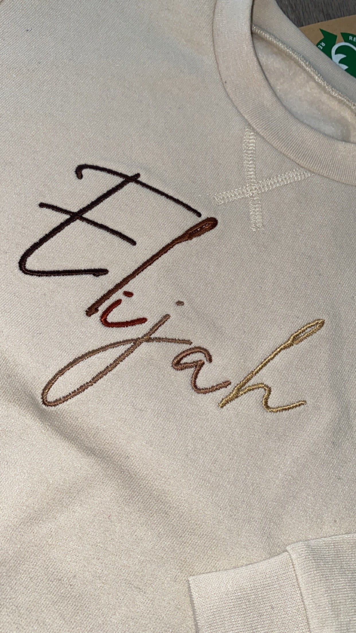 Nude Jumper with Brown Signature Font